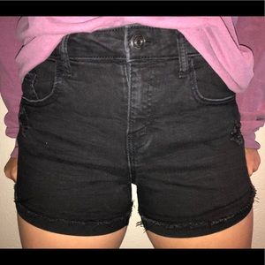 faded black jean shorts with rips